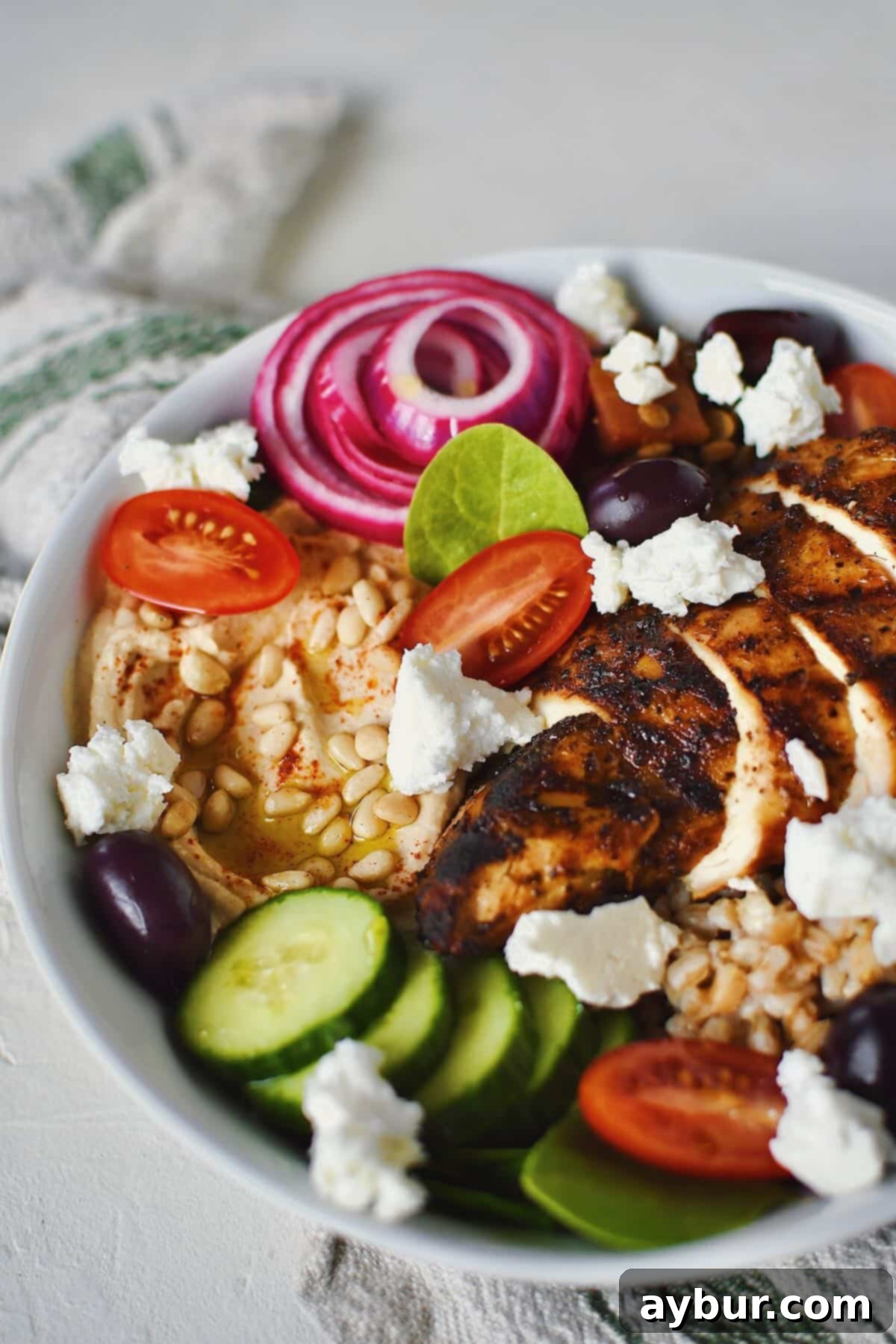 Vibrant Mediterranean Harvest Bowl 2 A beautifully arranged Mediterranean Bowl, brimming with fresh ingredients and ready to be enjoyed.