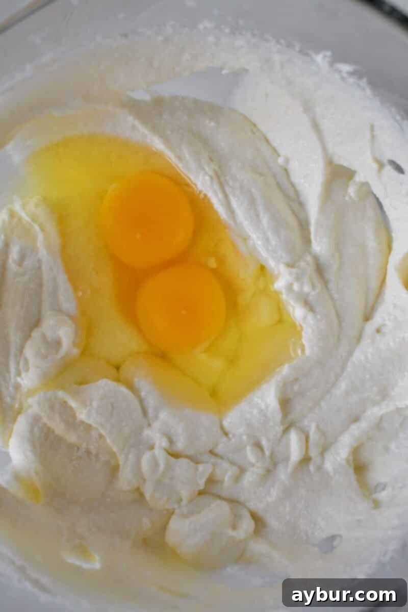 Classic Italian Ricotta Cheesecake 10 Gently incorporating the eggs into the cheesecake batter as the final step before baking, ensuring not to overmix.