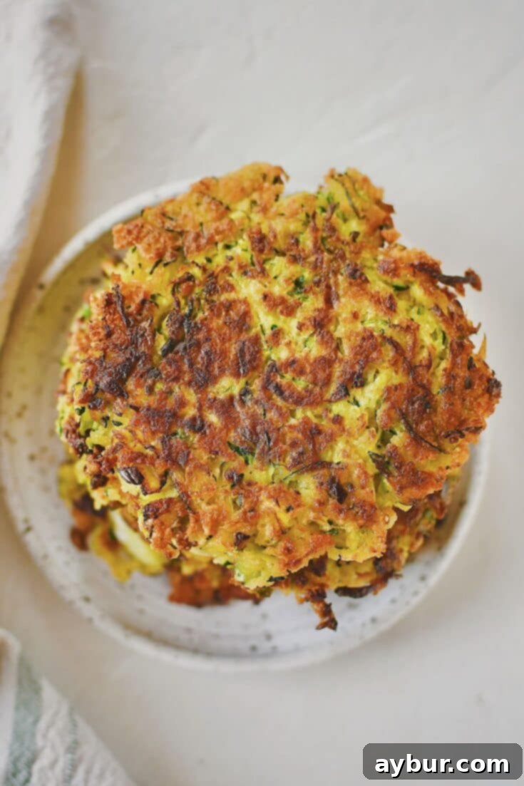 Crispy golden zucchini fritters ready to be devoured.