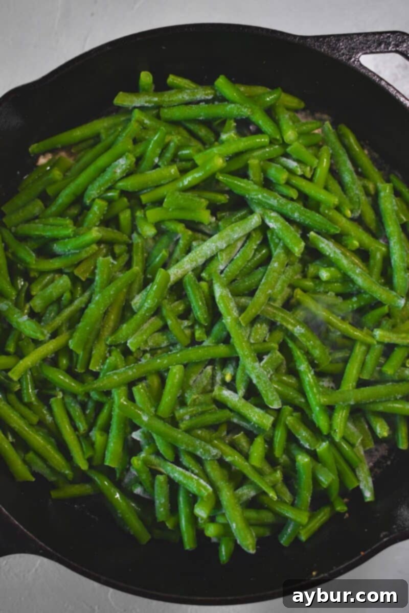 Creamy Green Beans 5 Frozen Green Beans added to the pan.