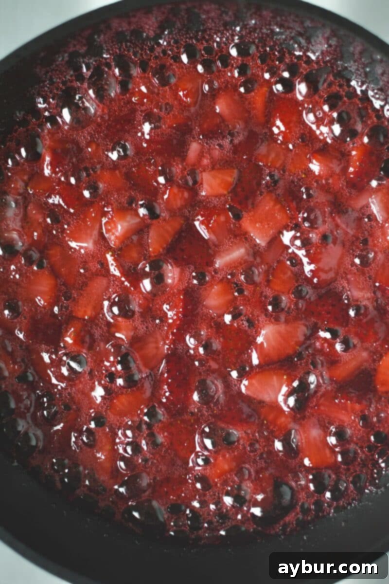 Strawberry Delight 11 Perfectly cooked fresh strawberries, with just a hint of syrup, ready to be folded into the churned ice cream for bursts of natural fruit flavor and texture.