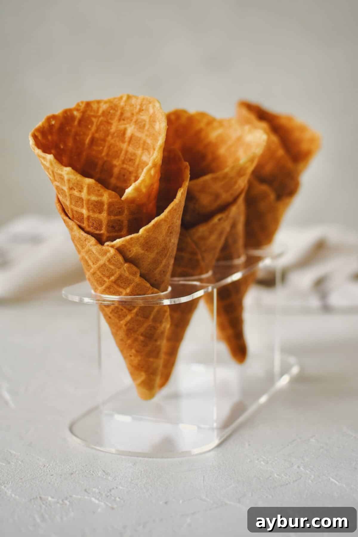 Crispy Homemade Waffle Cones 17 Finished Waffle Cone Recipe resting in a stand and ready to be filled with ice cream.