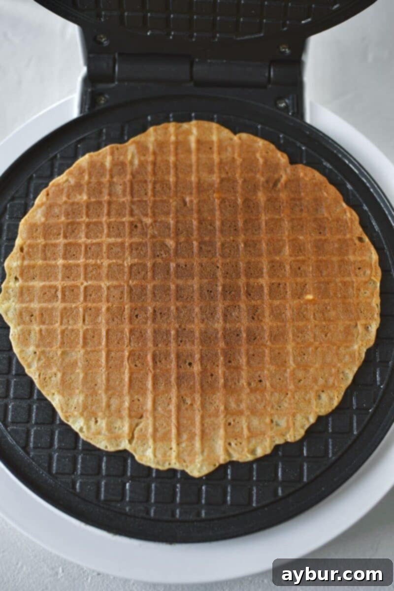 Crispy Homemade Waffle Cones 9 A scoop of waffle cone batter on a iron, after cooking.