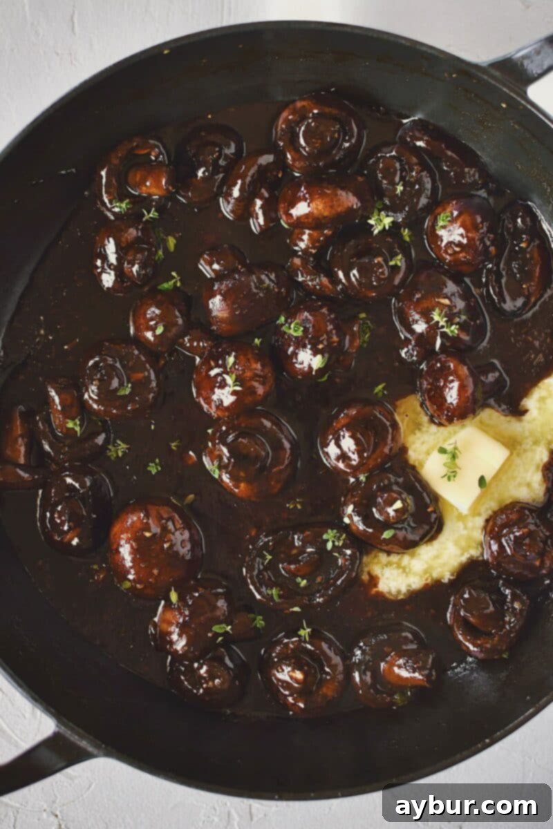 The final touch: stirring in the last of the butter and fresh thyme to create an extra rich and glossy finish before serving.