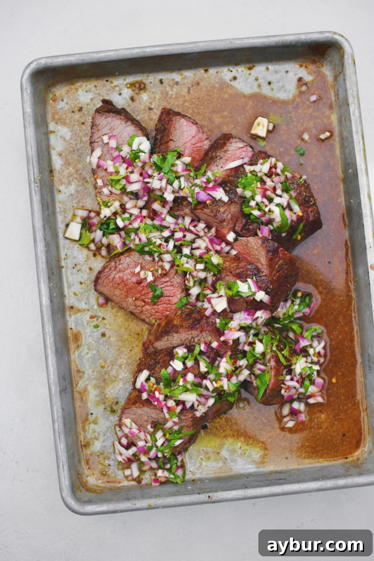 Perfect Tri-Tip Every Time 8 Beautifully sliced Tri-Tip steak presented for serving, highlighting its tender texture and perfect doneness.