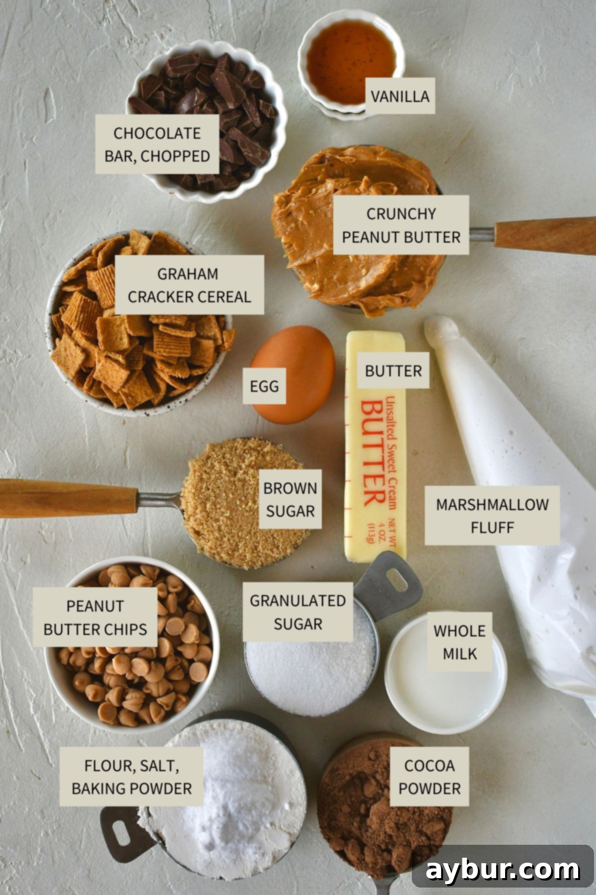 Gooey Chocolate Marshmallow Cookies 3 Fresh ingredients laid out for baking Chocolate Marshmallow Cookies, including cocoa powder, peanut butter chips, and marshmallow fluff.