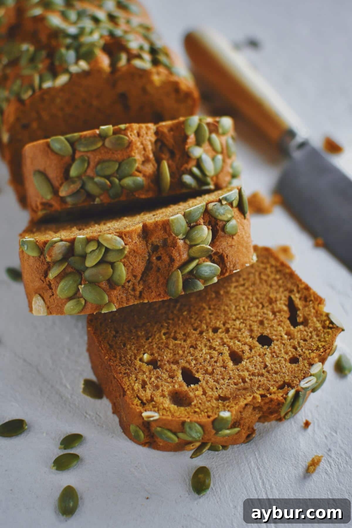 A final, beautiful overhead shot of a freshly baked, perfectly sliced Pumpkin Spice Bread.