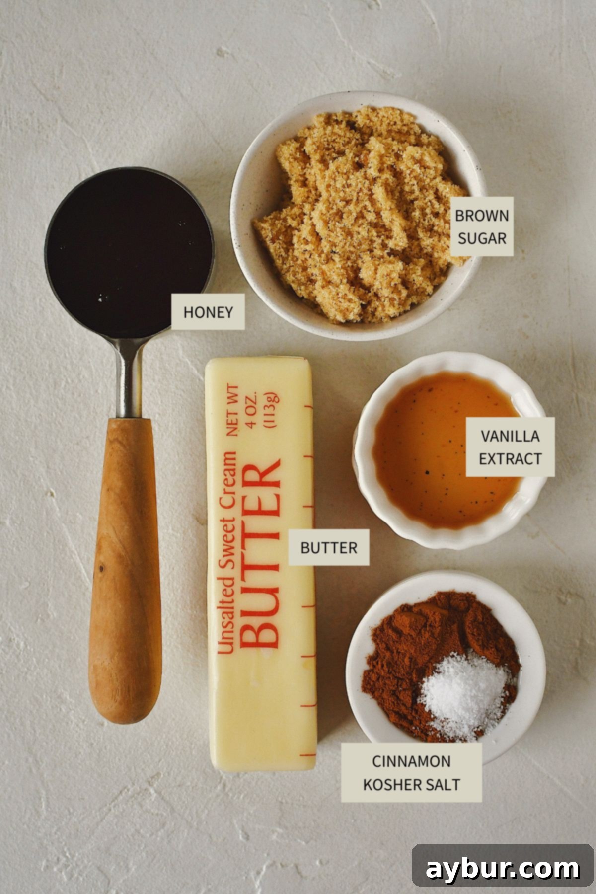 Sweet Cinnamon Butter 3 All the fresh and flavorful ingredients meticulously arranged for making homemade Cinnamon Butter, including butter, honey, cinnamon, salt, brown sugar, and vanilla extract.