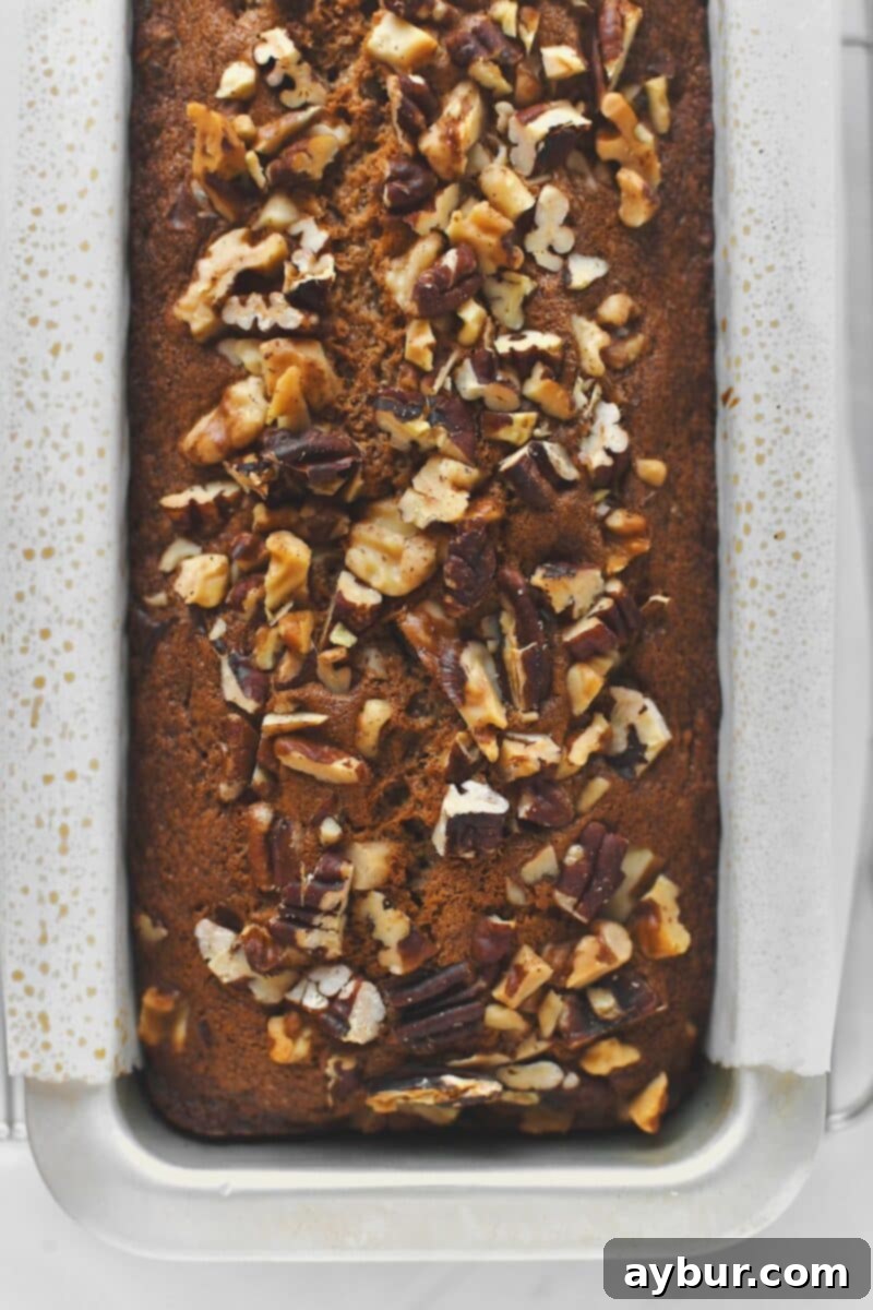 Banana bread still in the baking tin just out of the oven.