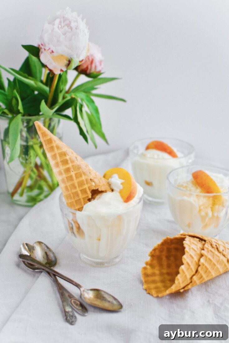 Sweet Peach Dream 15 Homemade Peach Ice Cream scoops in a bowl with fresh peaches.