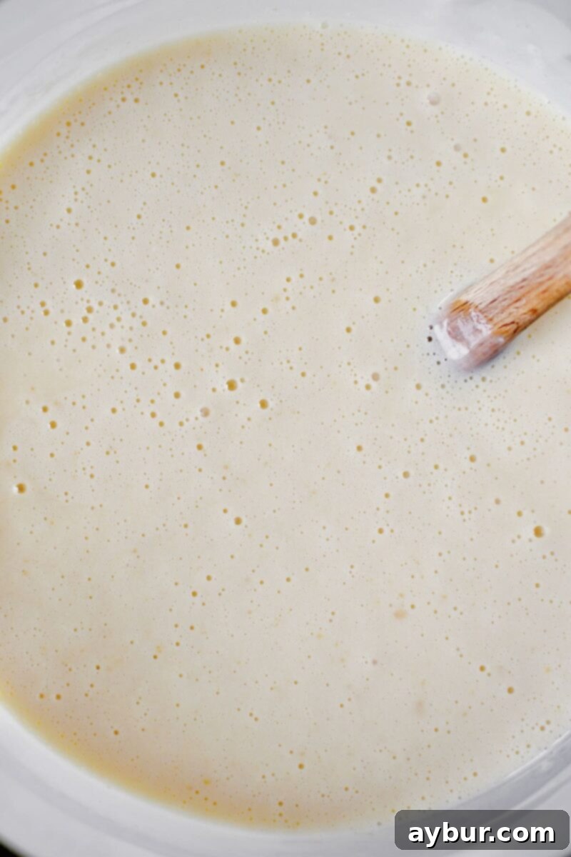Sweet Peach Dream 7 The smooth ice cream base transferred to a large measuring cup, ready for chilling in the refrigerator overnight.