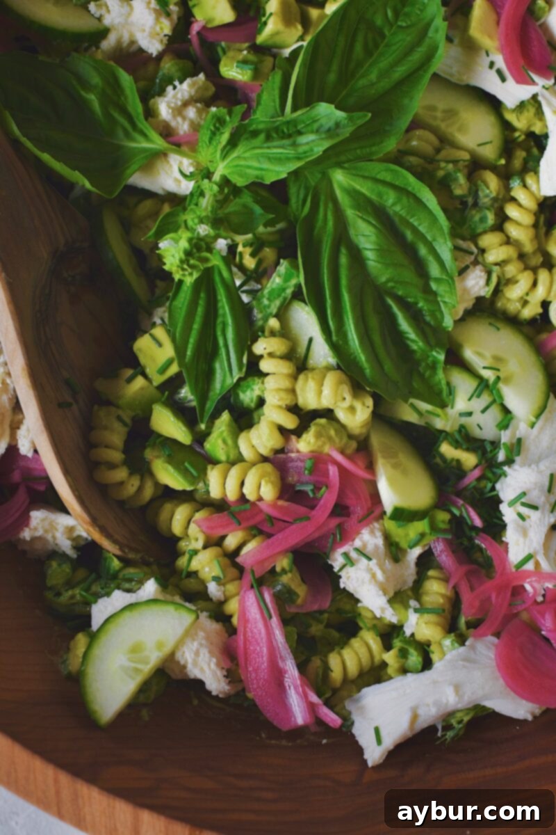 Vibrant Green Goddess Pasta 10 The Green Goddess Pasta Salad, fully mixed and ready for chilling, showcasing its fresh and vibrant ingredients.
