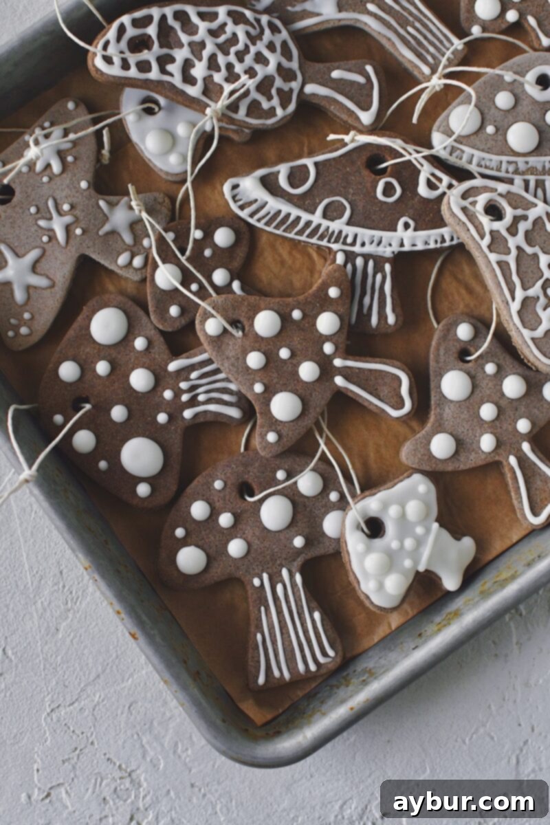 Salt Dough Gingerbread Keepsakes 14 Finished Gingerbread Salt Dough ornaments decorated with icing and strings attached, ready to go on a christmas tree.