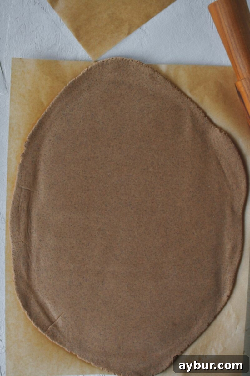 Salt Dough Gingerbread Keepsakes 9 Salt dough after rolling out thin between two pieces of parchment paper.