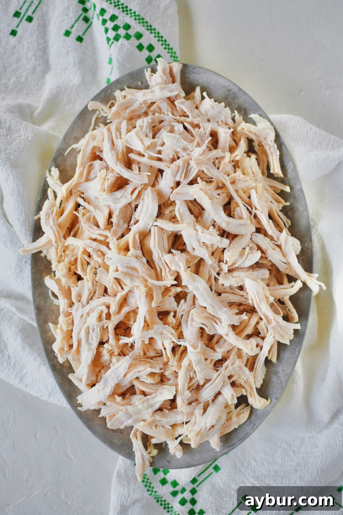 Perfectly shredded poached chicken, ready for salads and sandwiches.