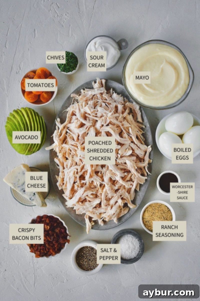 Ingredients needed to make Cobb Style Chicken Salad, neatly arranged for preparation. Fresh, colorful, and ready to transform into a delicious meal.