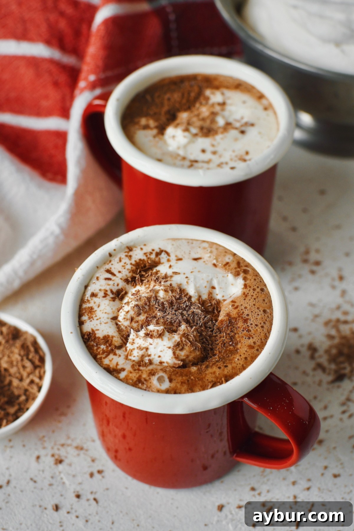 Simple 3-Ingredient Nutella Hot Chocolate 5 A close-up shot looking into a steaming mug of rich Nutella Hot Chocolate, showing its creamy texture.