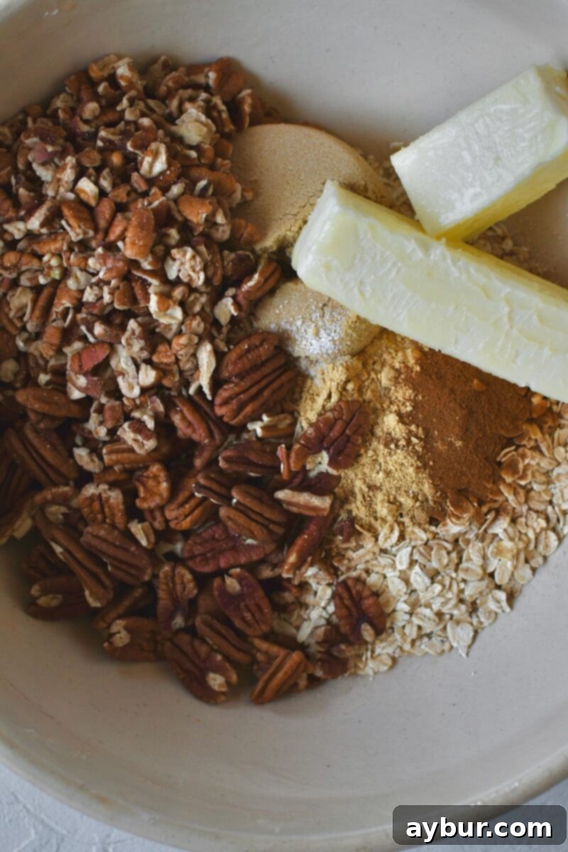 In the same bowl used for peaches, adding oats, brown sugar, pecans, and butter before mixing for the crisp topping.