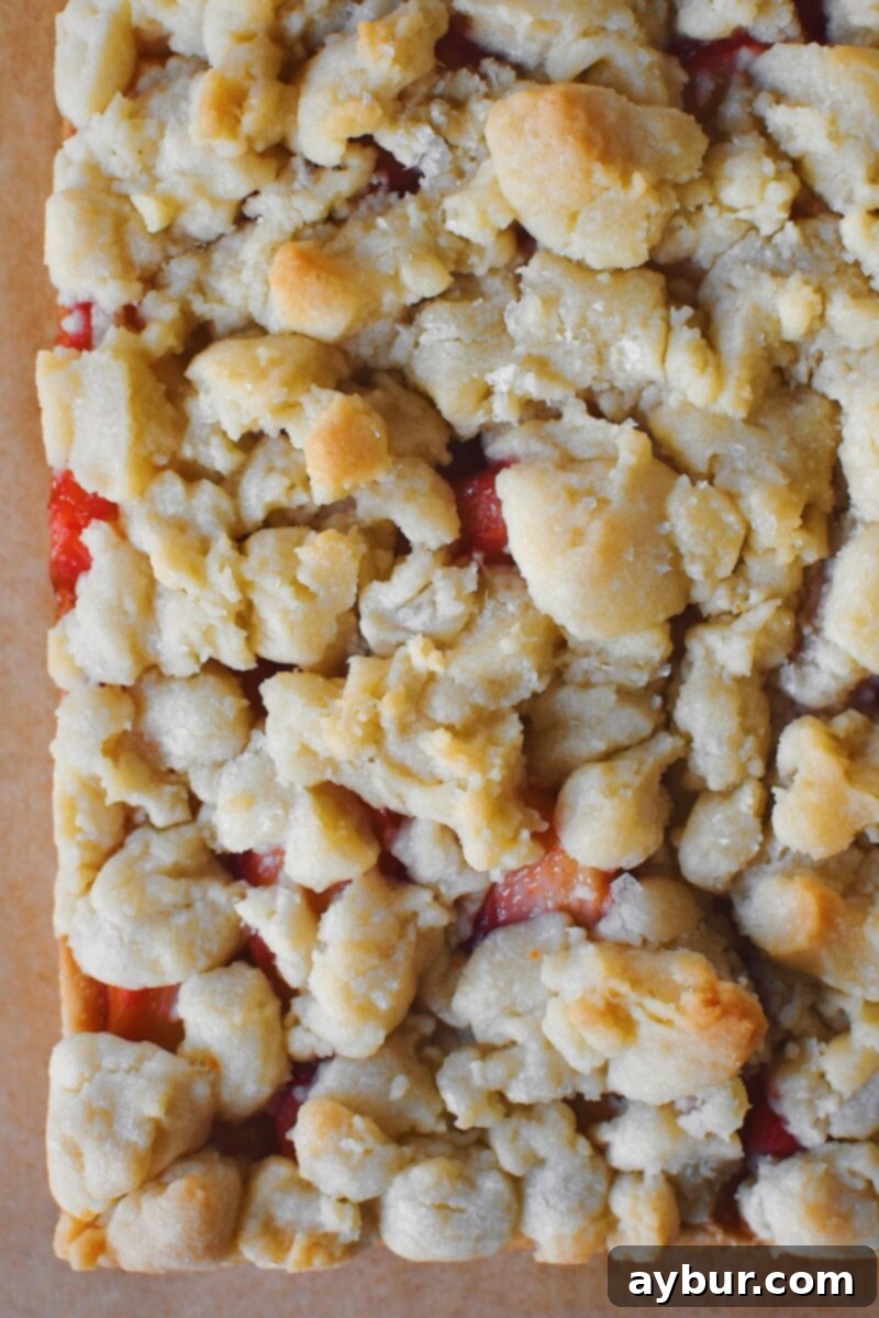 Baked Peach Shortbread Bars on a cutting board, before icing.