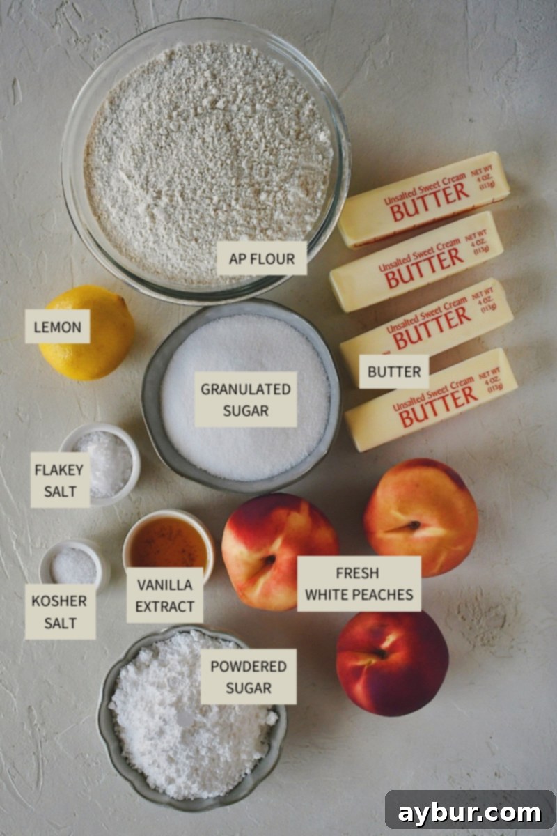 Various ingredients laid out for making White Peach Bars, including butter, flour, sugar, peaches, and lemon.