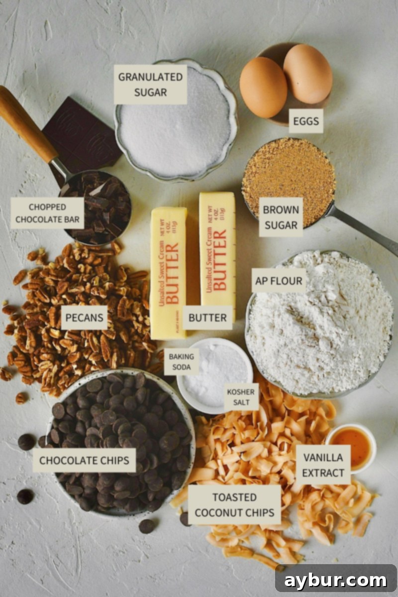 A beautifully arranged selection of all the necessary ingredients, including butter, sugars, eggs, flour, chocolate, pecans, and coconut chips, ready to be transformed into delicious cookies.