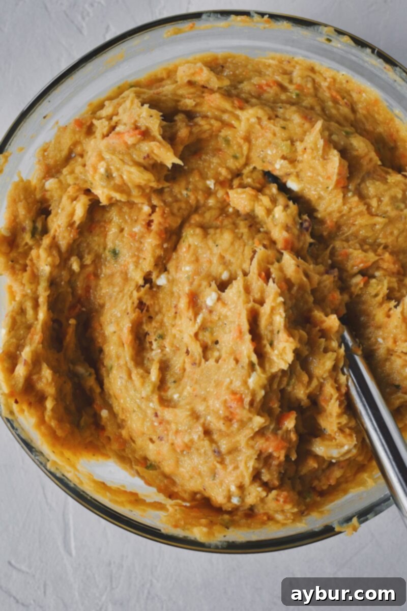 Spicy Buffalo Chicken Meatballs 8 Chicken meatball mixture fully blended together in a large bowl.