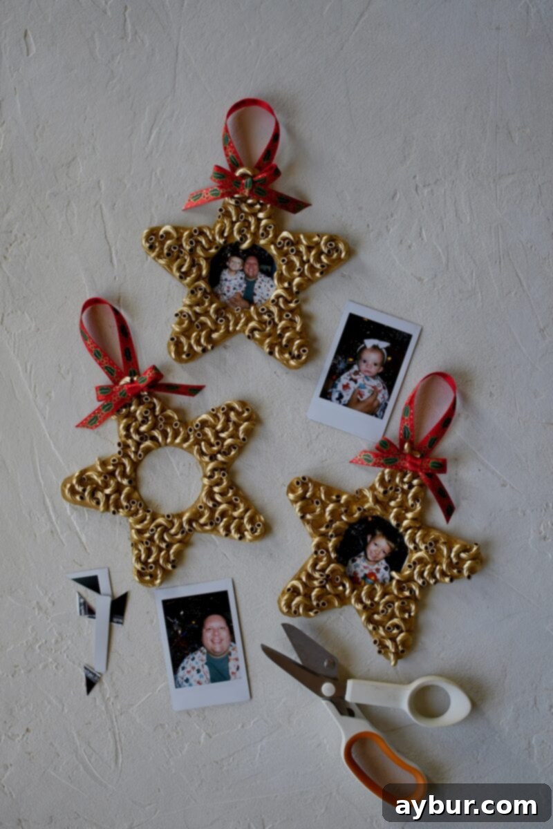 Dry Macaroni star ornaments after spray painting gold, with polaroid pictures around them, ready to be cut to size.