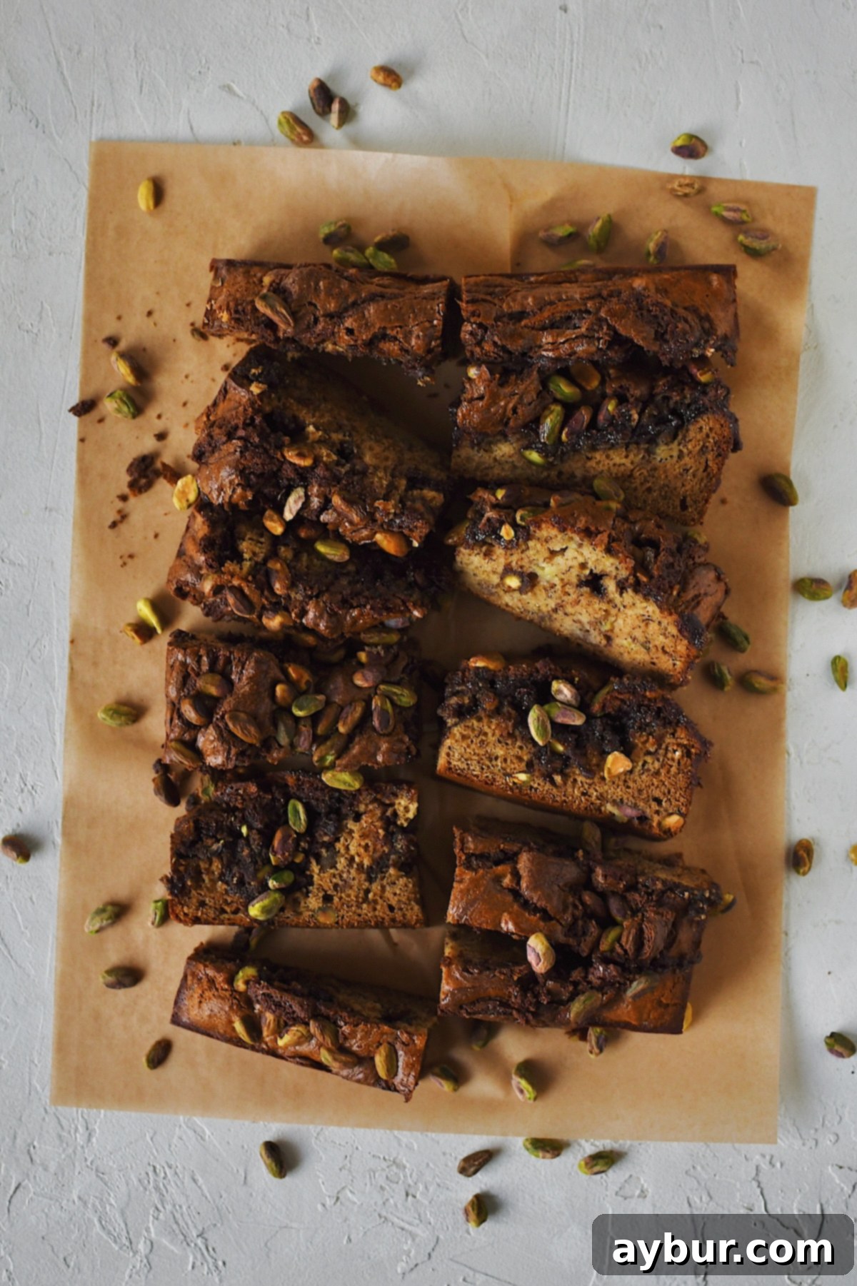 Full size photo of pistachio banana bread swirled with nutella, inspired by a dubai chocolate bar.