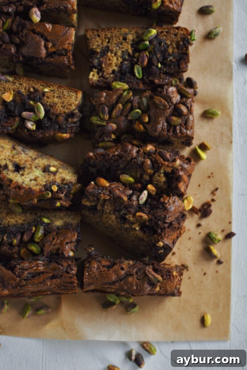 Pistachio Banana Bread, inspired by a dubai chocolate bar, swirled with nutella and studded with pistachios.