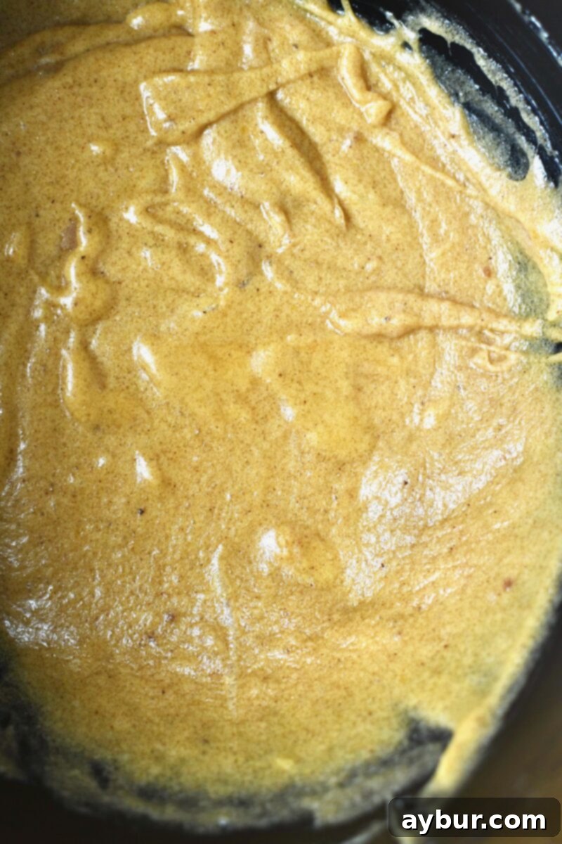 Butter, sugars, and eggs beat together to for the base of the banana bread batter.