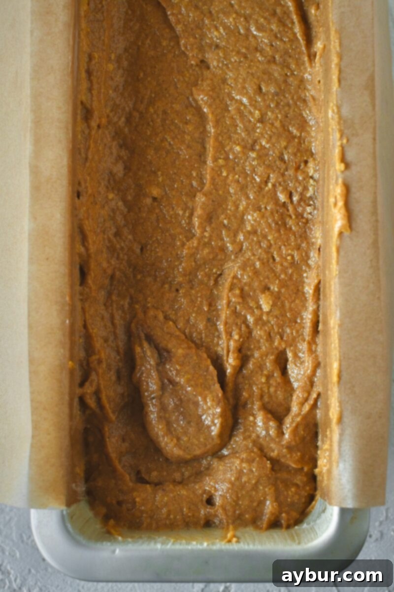 After folding in the flour, pumpkin spice, salt, and baking powder, and batter placed in a prepared pan.