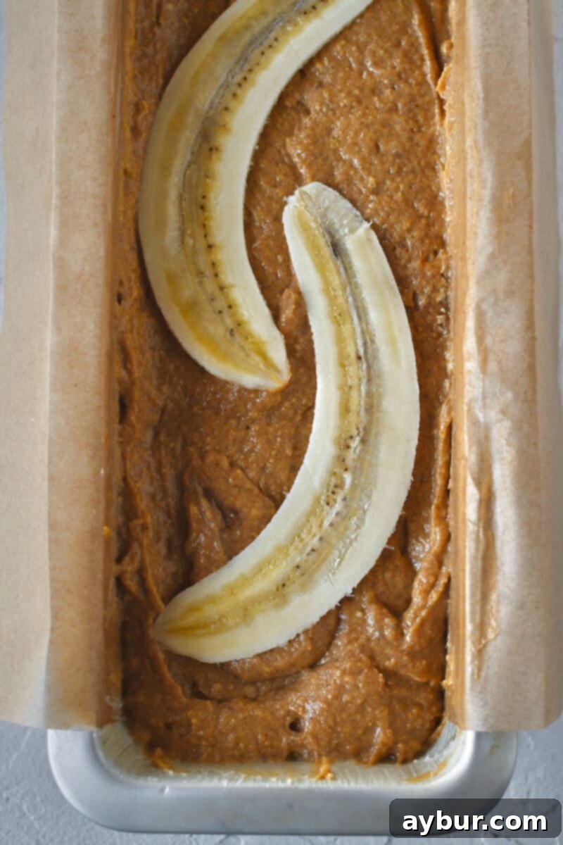 Halved banana added on top of the batter.