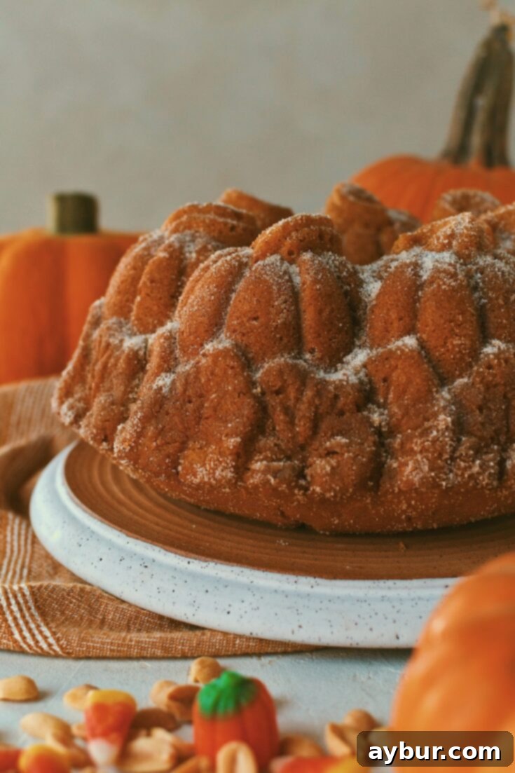 Beautifully sliced pumpkin donut bundt cake, showing its moist interior.
