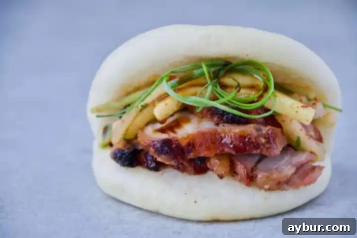 Fluffy Steamed Buns 3 Finished Bao Buns ready to be filled, showing their soft, white texture