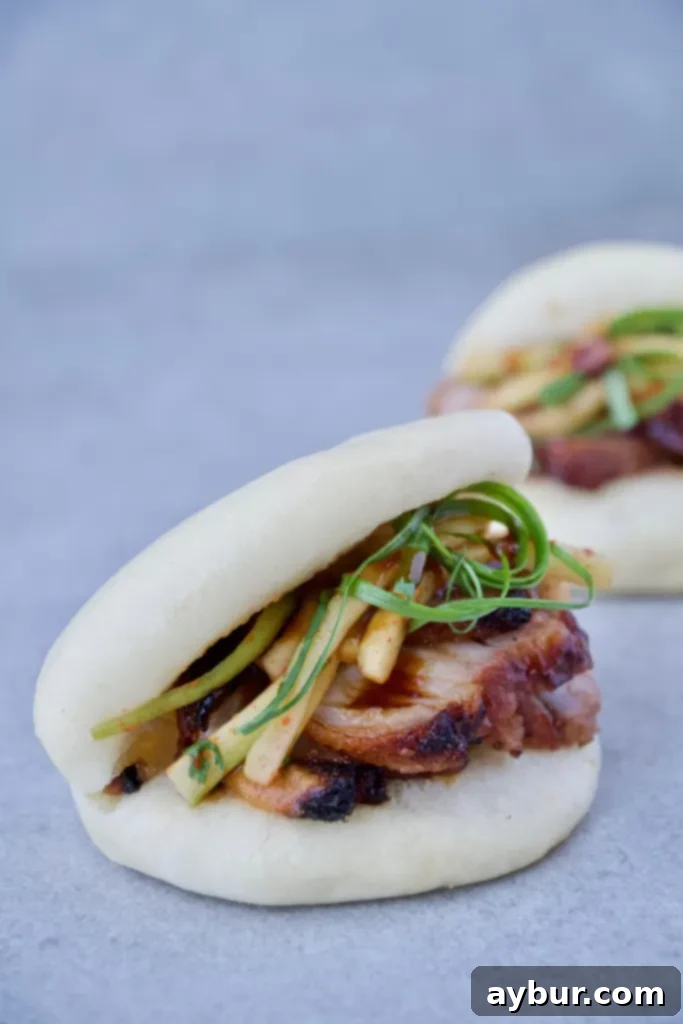 Fluffy Steamed Buns 4 Roasted Pork Belly filled Bao Buns with fresh garnishes