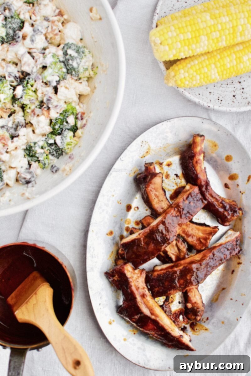 Tender Fall-Off-The-Bone Instant Pot BBQ Ribs 6 Instant Pot BBQ Ribs served with complementary side dishes for a complete meal