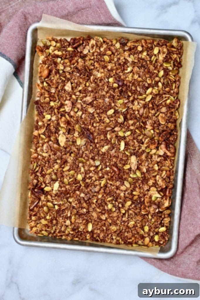 Pumpkin Seed Granola served in a bowl with milk and fresh berries