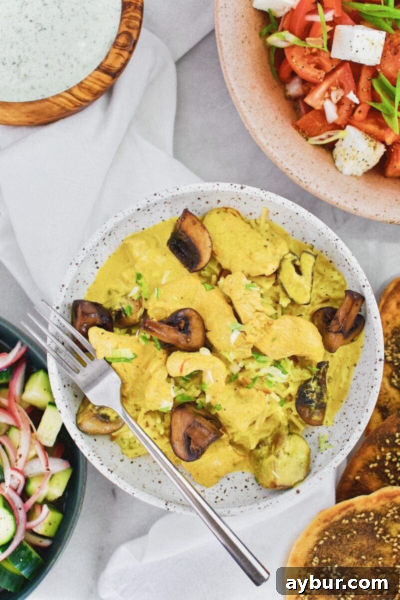 Mediterranean Chicken and Mushrooms simmered in a rich saffron coconut sauce
