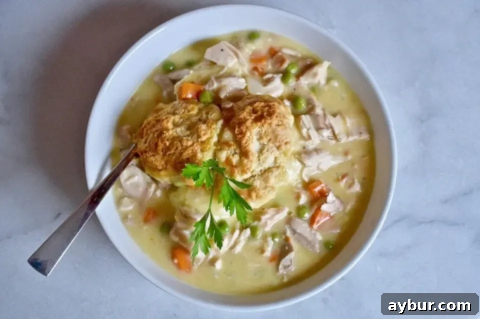 A bowl of creamy mashed potatoes, ready for the pot pie topping.