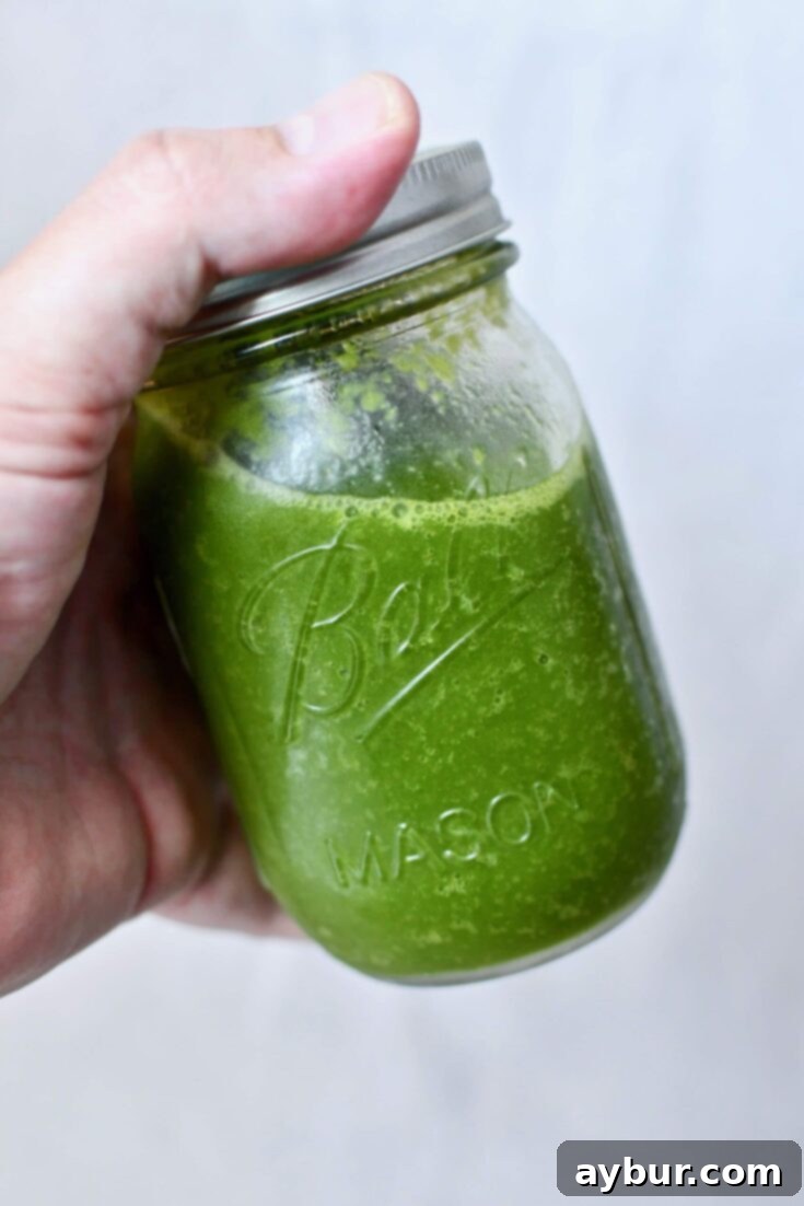 Puerto Rican Sofrito 3 Vibrant green Sofrito in a glass jar, ready for cooking.