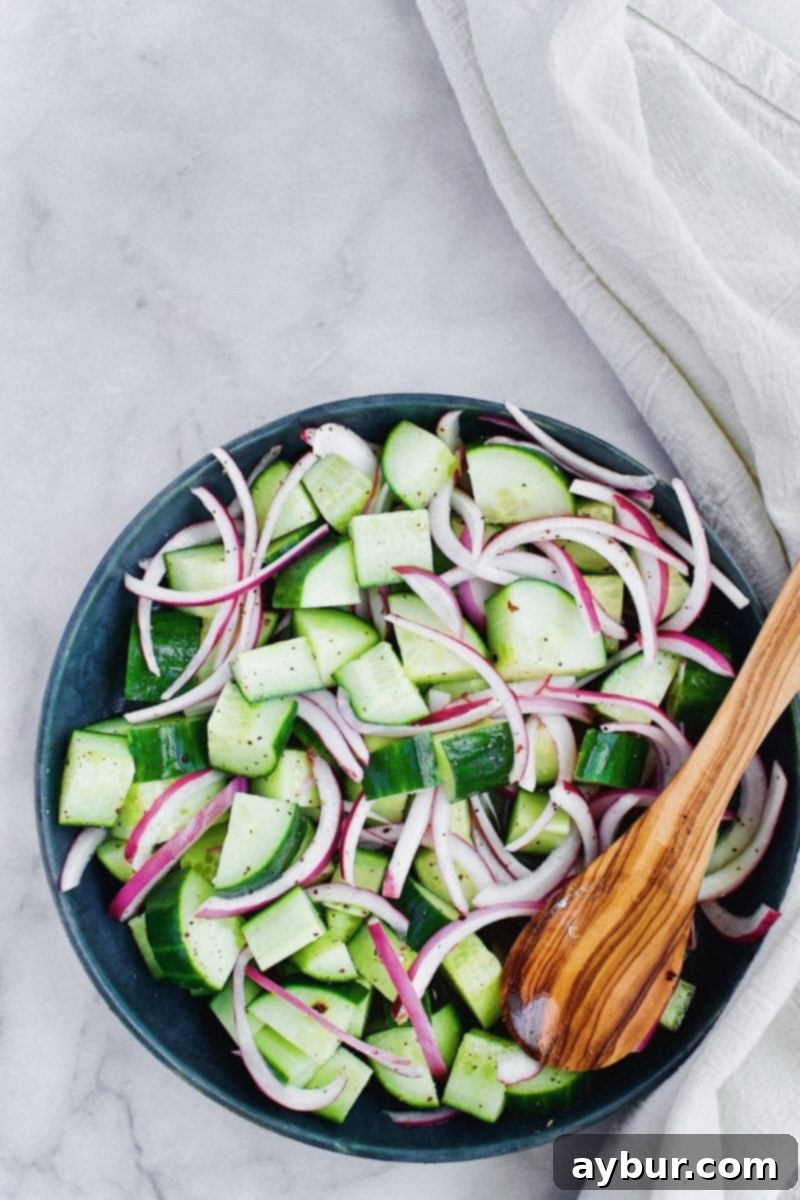 Instant Onion and Cucumber Pickles 4 Close-up of Quick Pickled Cucumbers and Red Onions marinating in a bowl, showing the vibrant colors