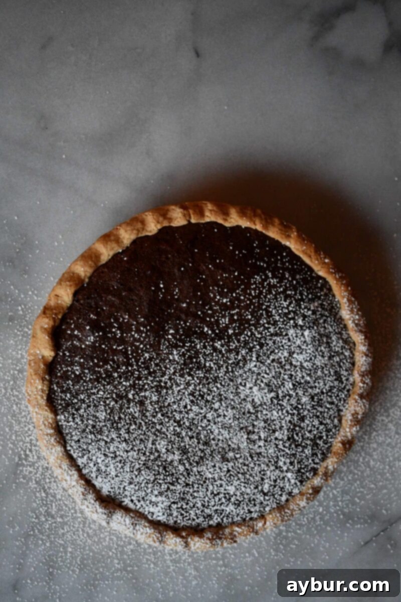 A perfectly baked Joanna Gaines brownie pie, showing its fudgy interior and flaky crust, prepared by KendellKreations