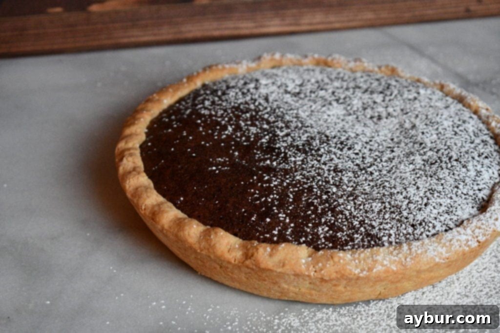 Joanna Gaines brownie pie cooling on a rack, showcasing its beautiful crust and rich color