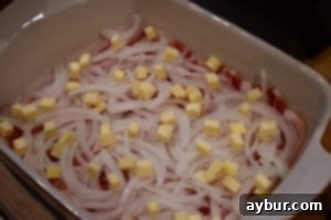 Ingredients for Baked Chicken with Bacon Bottom, showing bacon slices, onions, and butter
