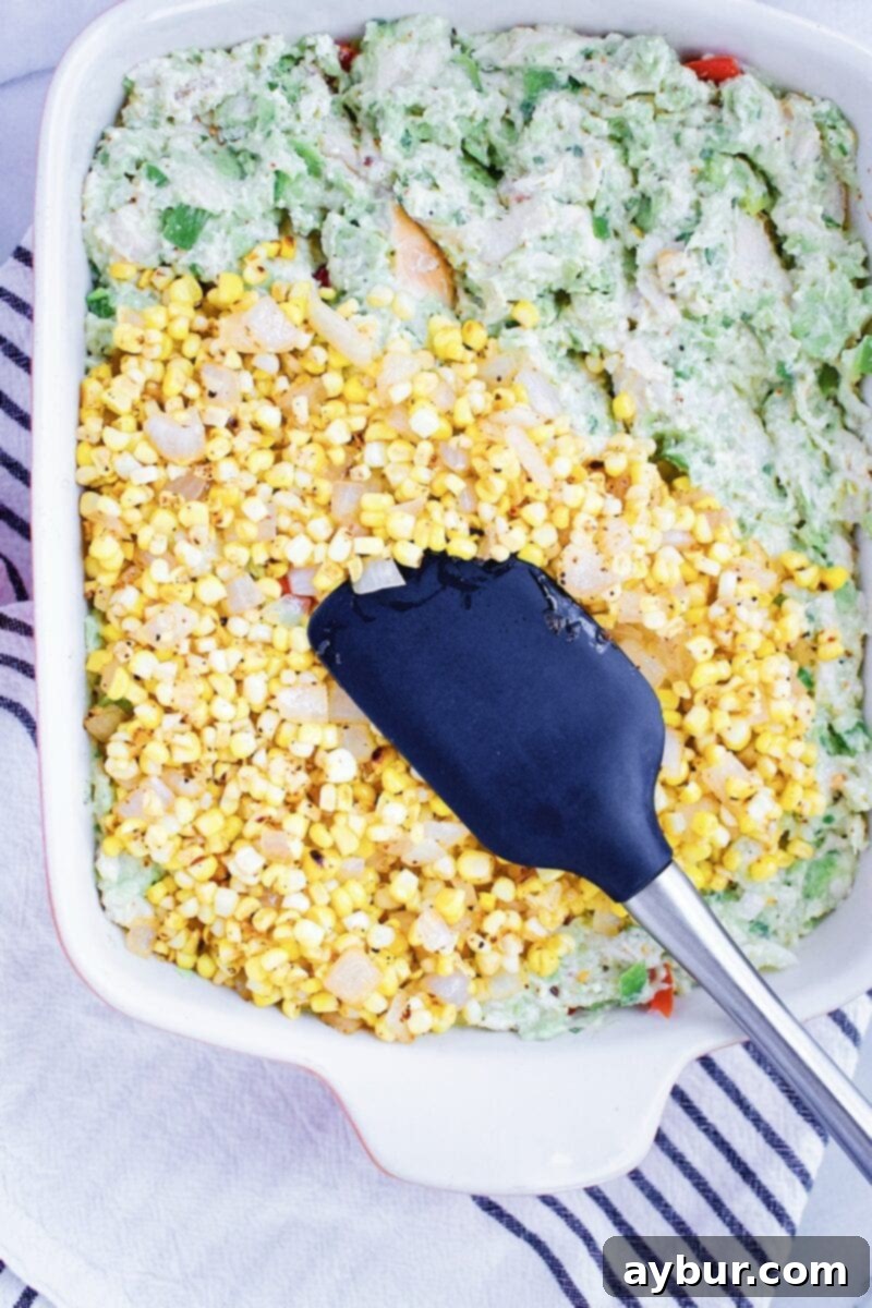 Assembling Chicken Enchilada Casserole layers in a dish