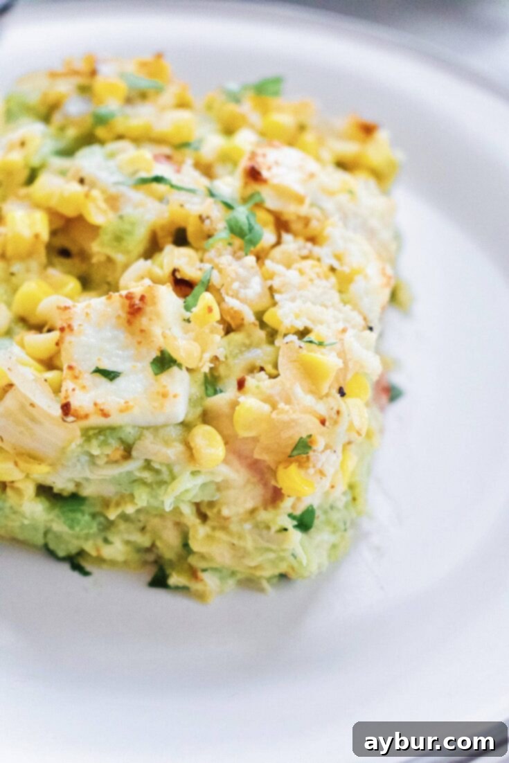 Creamy Chicken Enchilada Bake with street corn topping