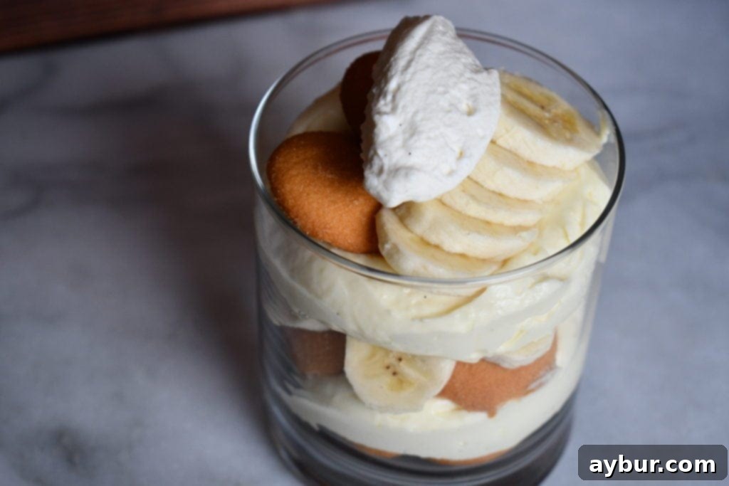 Aunt Opal's Banana Pudding Perfection in Every Spoonful 6 Aunt Opal's Banana Pudding in a trifle dish, ready to serve, a highlight from Joanna Gaines' Magnolia Table Cookbook