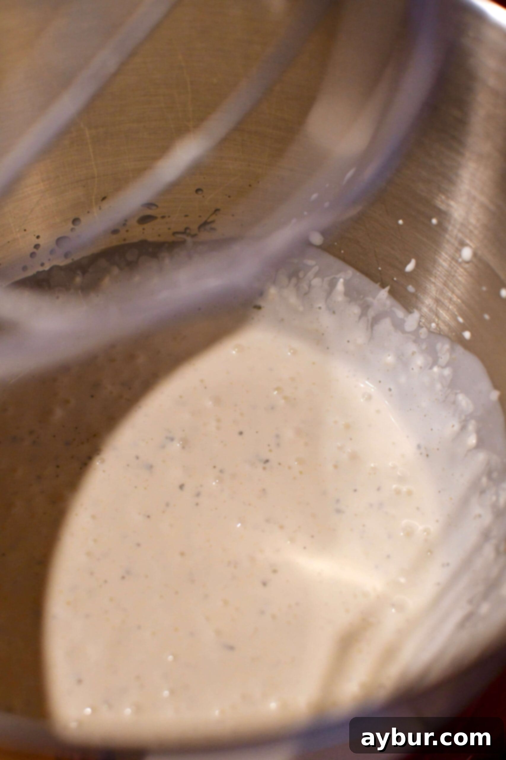 Starting with a base of ranch dressing mix, mayonnaise, and buttermilk to make Buffalo Chicken Cheese Dip.