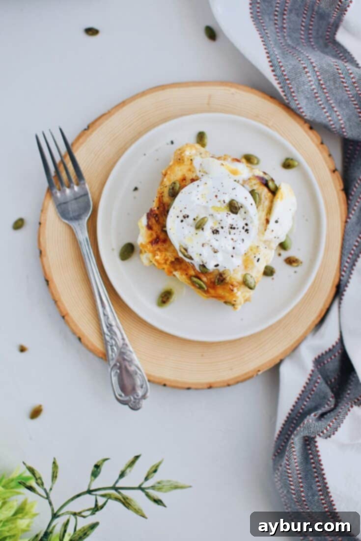 Pumpkin Beer Cheese Lasagna with a topping of roasted pumpkin seeds