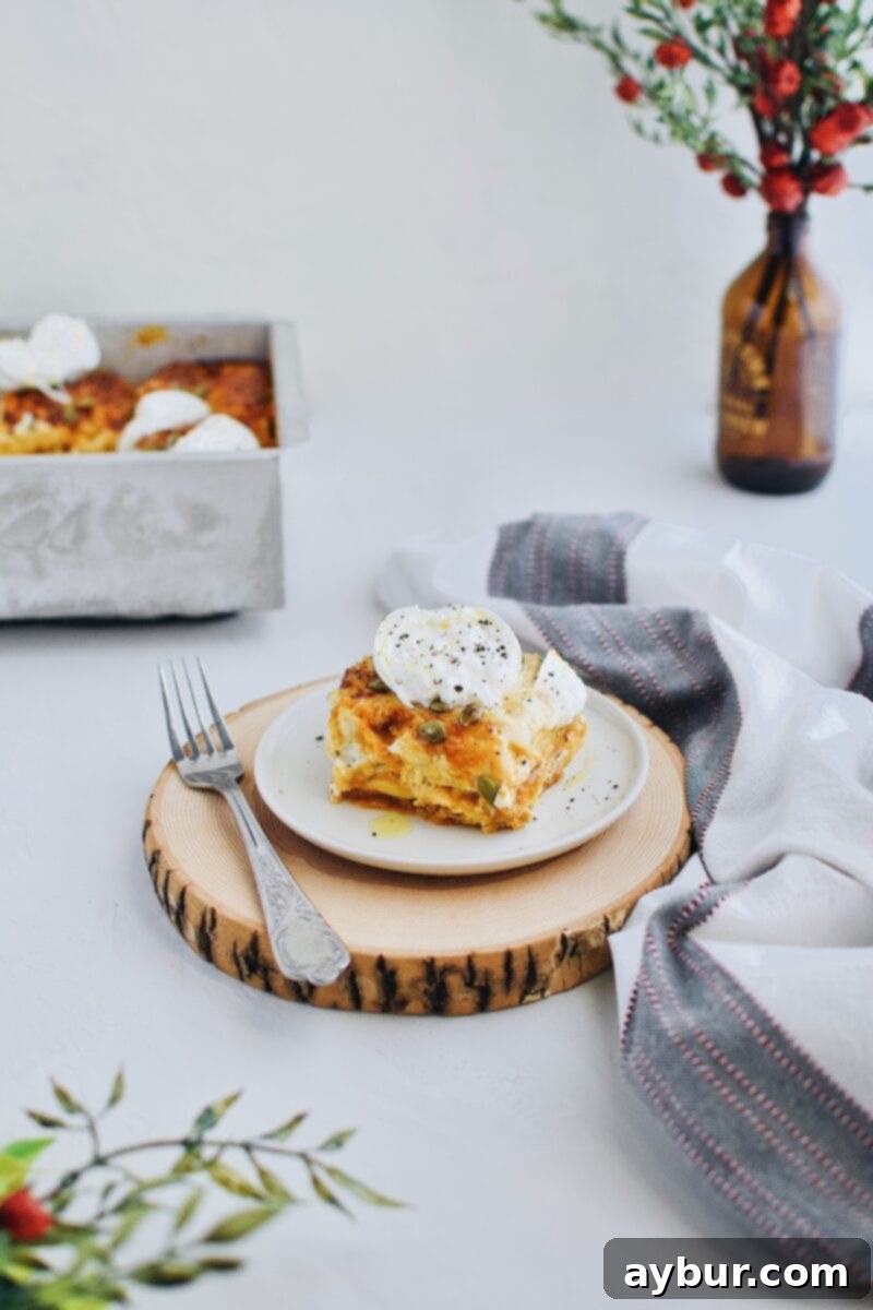 A delicious single slice of Pumpkin Beer Cheese Lasagna, ready to be enjoyed